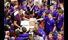As is tradition, Roger Federer throws a pizza party for the ball kids at the Swiss Indoors Basel after winning the tournament on Sunday.