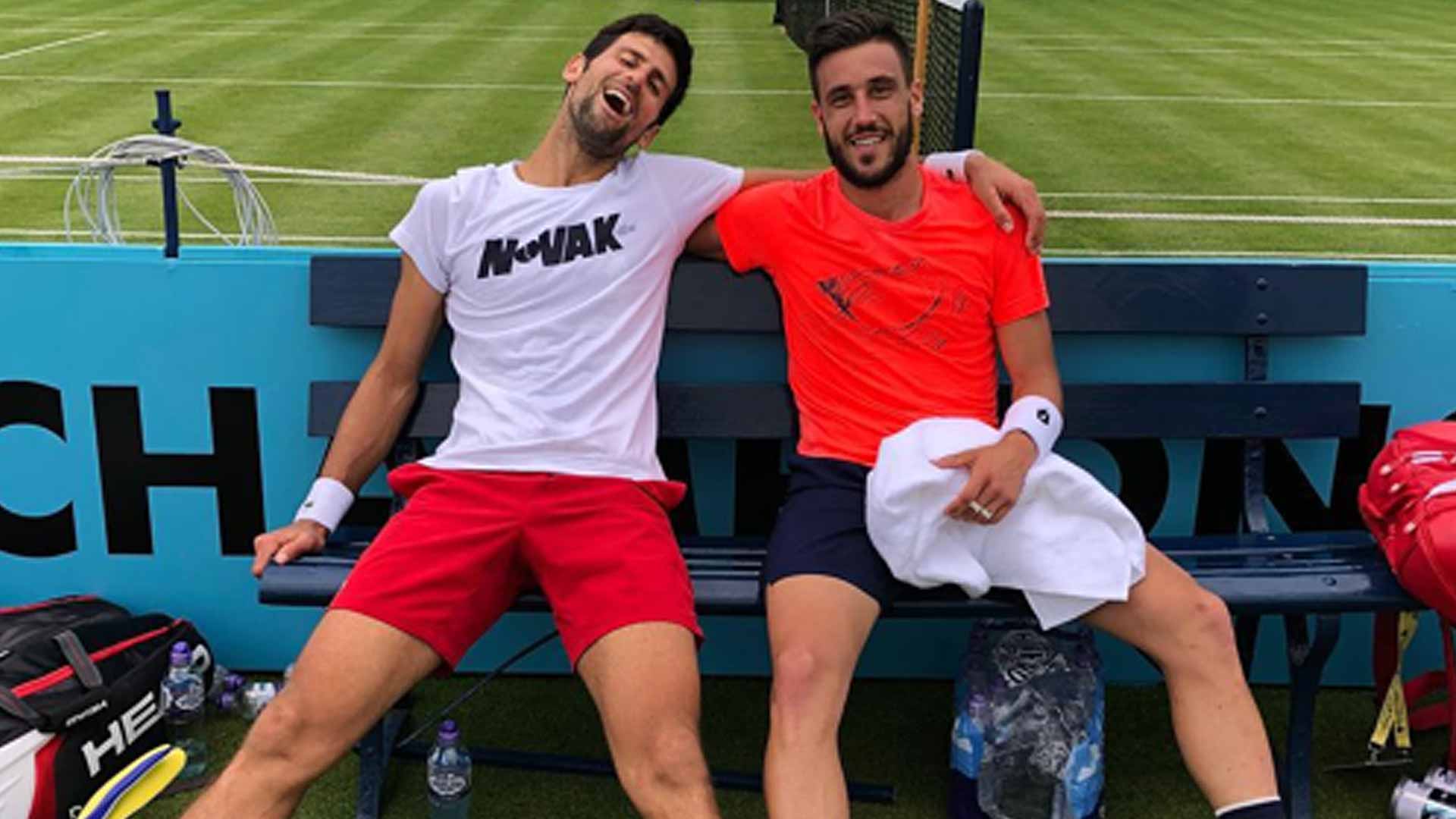 Damir Dzumhur and Novak Djokovic have fun at The Queen's Club in London.