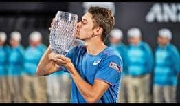 Alex de Minaur defeats Andreas Seppi in two hours and five minutes to win his first ATP Tour title at the Sydney International on Saturday.