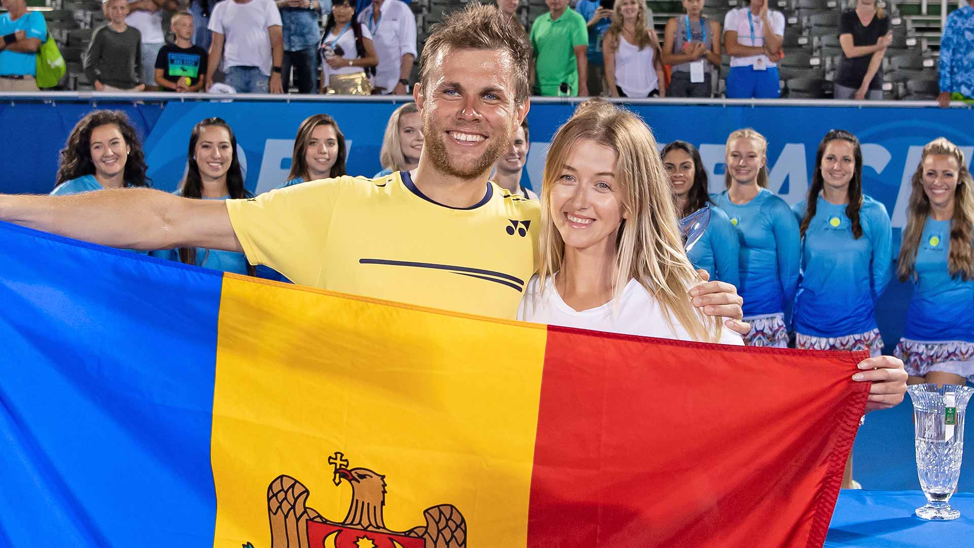Radu Albot celebrates his first ATP Tour title with his girlfriend in Delray Beach.