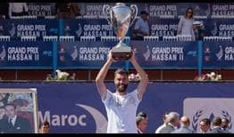 Benoit Paire lifts his second ATP Tour trophy in Marrakech.