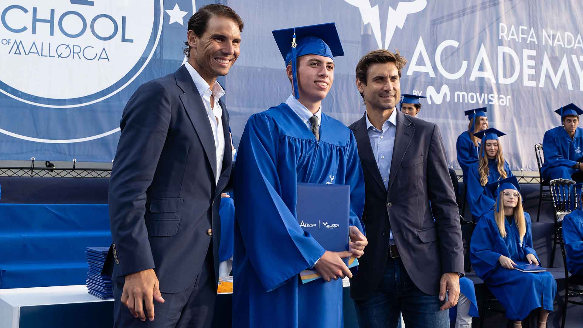 <a href='https://www.atptour.com/en/players/rafael-nadal/n409/overview'>Rafael Nadal</a> and <a href='https://www.atptour.com/en/players/david-ferrer/f401/overview'>David Ferrer</a> offer departing wisdom to the 2019 graduating class of the Rafa Nadal Academy by Movistar.