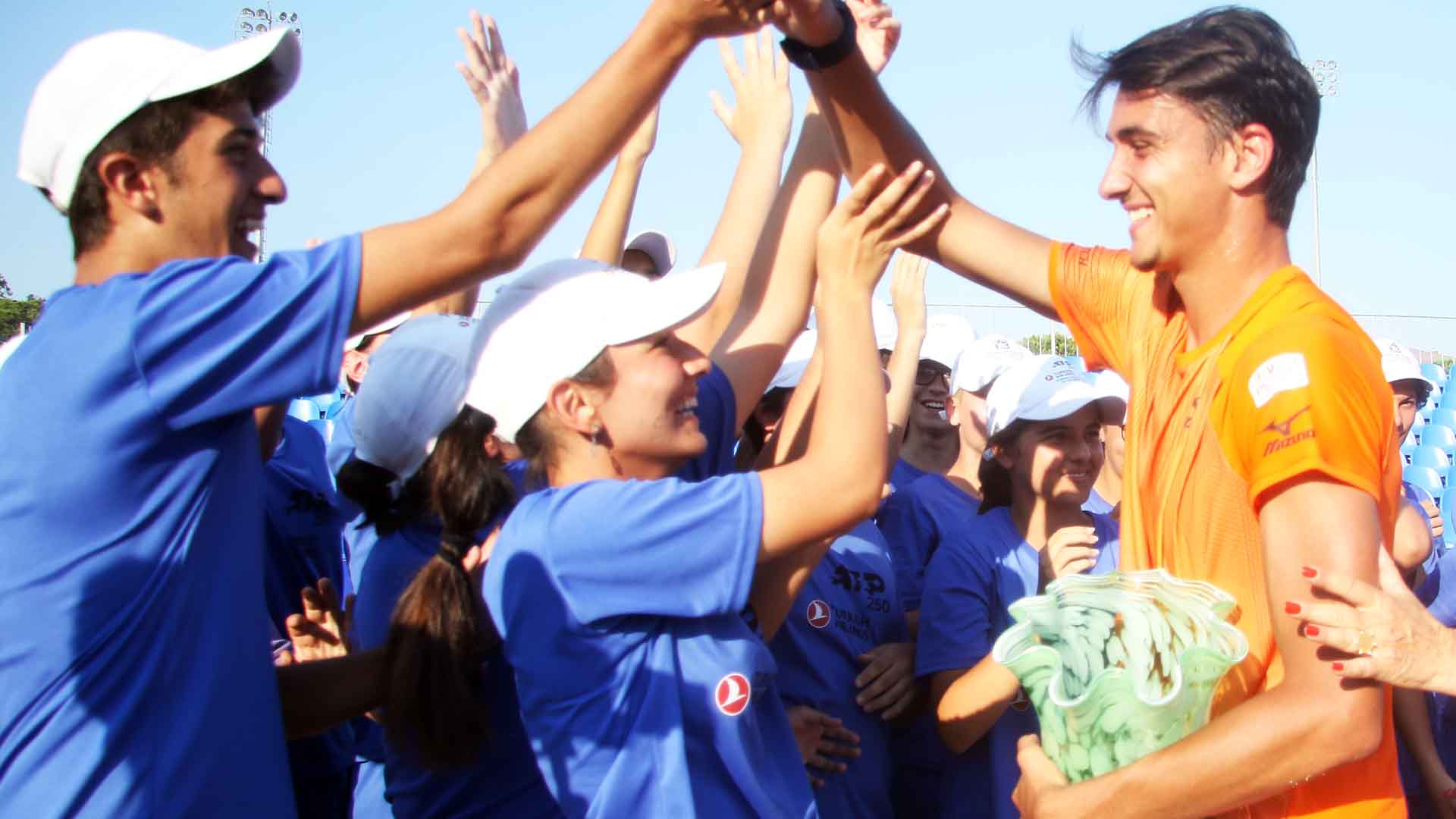 <a href='https://www.atptour.com/en/players/lorenzo-sonego/su87/overview'>Lorenzo Sonego</a> celebrates with ball kids after capturing the <a href='https://www.atptour.com/en/scores/archive/antalya/7650/2019/results'>Turkish Airlines Open Antalya</a> trophy on Saturday.