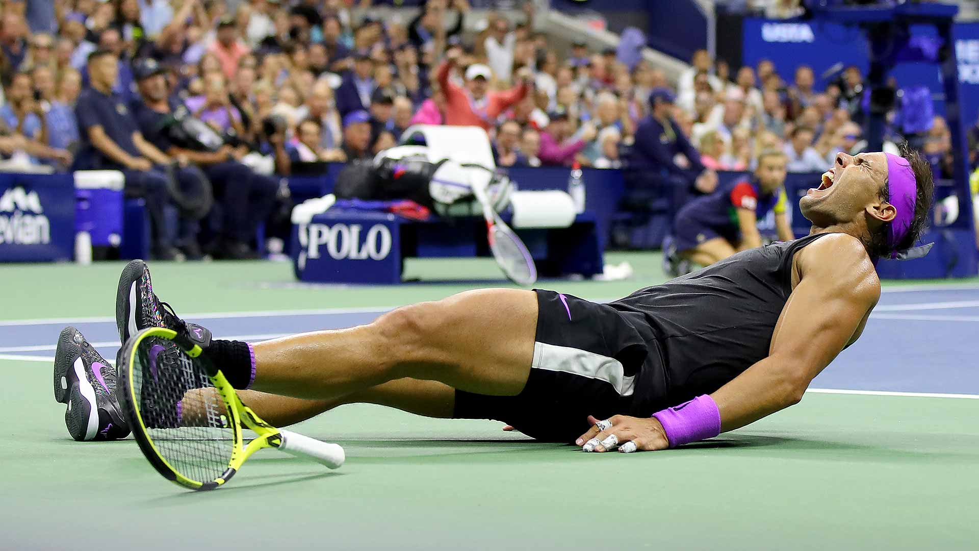 Rafael Nadal collapses after winning his fourth US Open title.