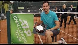 Gianluca Mager lifts the trophy at the ATP Challenger Tour event in Biella, Italy.