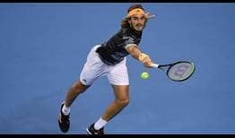 Third seed Stefanos Tsitsipas completes a polished performance against John Isner on Friday in Beijing.