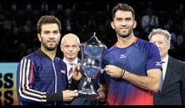 Jean-Julien Rojer and Horia Tecau lift their 20th tour-level team trophy at the Swiss Indoors Basel on Sunday.
