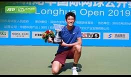 Zhang Zhizhen lifts his second ATP Challenger Tour trophy in Shenzhen.