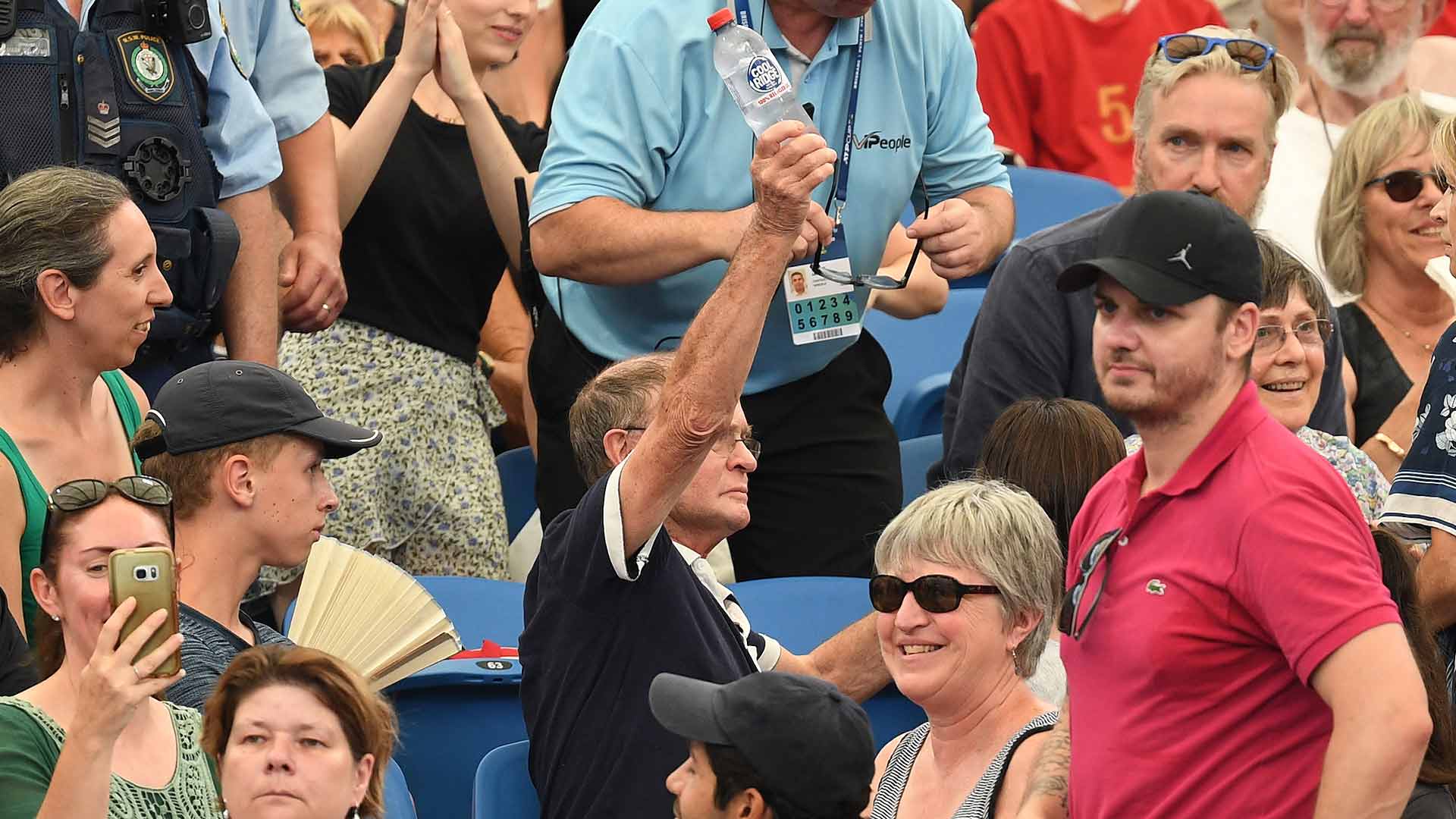 <a href='https://www.atptour.com/en/players/novak-djokovic/d643/overview'>Novak Djokovic</a> aids a fan with water on Friday at the <a href='https://www.atptour.com/en/tournaments/atp-cup/8888/overview'>ATP Cup</a> in Sydney.