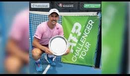 Steve Johnson lifts his first trophy of 2020 at the Bendigo Challenger.