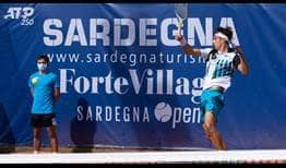 Lorenzo Musetti breaks Pablo Cuevas' serve three times en route to a first-round victory in Sardinia.