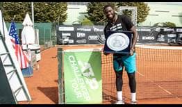 Frances Tiafoe lifts the trophy at the ATP Challenger Tour event in Parma.