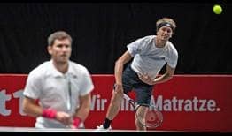Mischa Zverev and Alexander Zverev lose against third seeds Raven Klaasen and Oliver Marach in Cologne on Tuesday.