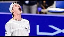 Ugo Humbert celebrates saving four match points to beat Daniel Evans on Saturday for a place in the Antwerp final.