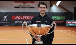 Marc-Andrea Huesler lifts his third ATP Challenger Tour trophy in Ismaning.