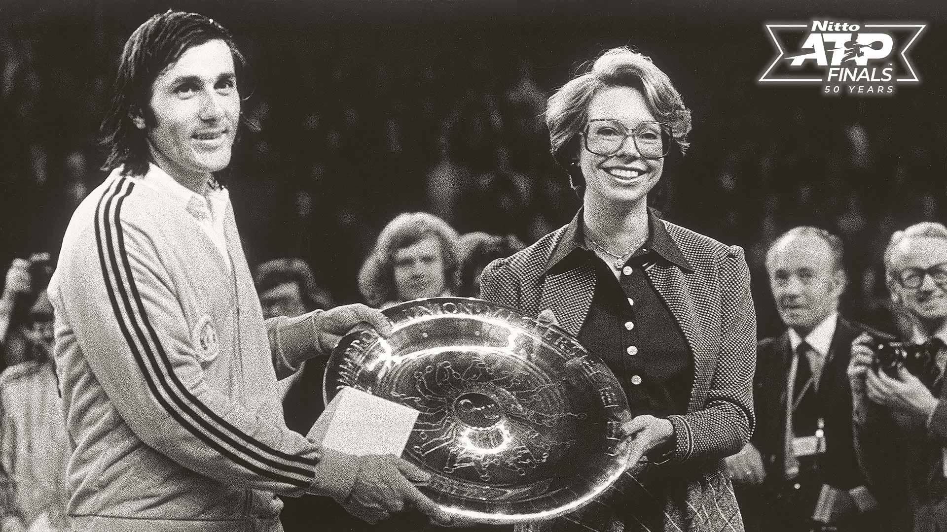 Ilie Nastase is presented with his fourth Masters trophy by Sweden's Princess Christina in Stockholm, 1975.