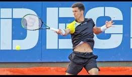 Aljaz Bedene loses five of his service games, but finds a way to reach the second round by defeating Giulio Zeppieri on Monday in Cagliari.