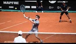 Ariel Behar volleys as Gonzalo Escobar watches on during the AnyTech365 Andalucia Open final on Sunday.