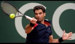 Pablo Andujar wins the first set against Roger Federer on Tuesday in Geneva.
