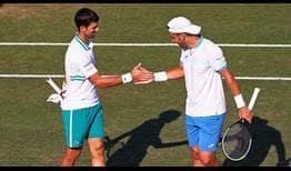 Novak Djokovic and Carlos Gomez-Herrera celebrate their first match win at the Mallorca Championships.