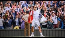 Roger Federer waves goodbye to fans on Centre Court after losing to Hubert Hurkacz at Wimbledon on Wednesday.