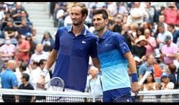 Daniil Medvedev and Novak Djokovic embrace at the net ahead of the US Open final. 