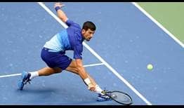 Novak Djokovic slides to hit a backhand during the US Open final on Sunday.
