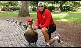 John Isner visits the ‘Make Way for Ducklings’ statues, the well-known bronze ducks located in Boston Common.