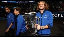 Stefanos Tsitsipas holds the Laver Cup trophy after Team Europe defeats Team World 14-1 in Boston.