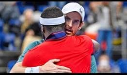 Andy Murray embraces Frances Tiafoe after defeating the American in three hours and 45 minutes in the opening round of the European Open. 