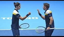 Pierre-Hugues Herbert and Nicolas Mahut win 20 of their 25 service points in the first set of the title-match Sunday at the Nitto ATP Finals.