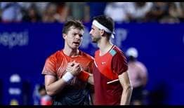 Stefan Kozlov and Grigor Dimitrov embrace after their three-set epic in Acapulco on Monday night.