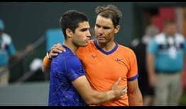 Carlos Alcaraz and Rafael Nadal embrace following their match on Saturday in Indian Wells.