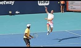 Joe Salisbury [right] jumps for a smash in his match with Rajeev Ram [left] on Wednesday in Miami.