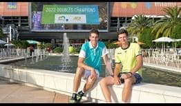 John Isner and Hubert Hurkacz celebrate their win at the 2022 Miami Open presented by Itau.