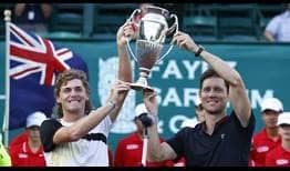 Max Purcell (left) and Matthew Edben lift their first ATP Tour trophy as a team.