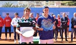 Holger Rune (right) celebrates his fifth ATP Challenger title in Sanremo, Italy.