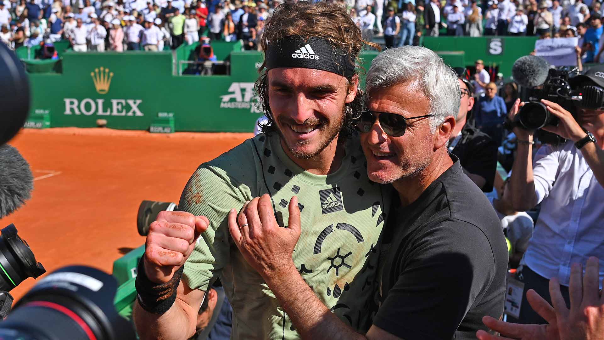 Stefanos Tsitsipas celebrate's his successful Monte Carlo title defence with his father, Apostolos Tsitsipas, who is also his coach.