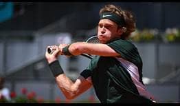 Andrey Rublev advances past Daniel Evans to reach the quarter-finals of the Mutua Madrid Open on Thursday.