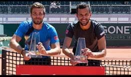 Nikola Mektic and Mate Pavic celebrate winning the title in Geneva on Saturday.