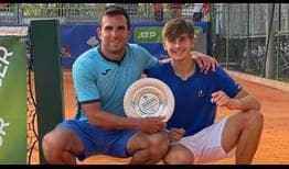 Matteo Arnaldi claims his maiden ATP Challenger title in Francavilla al Mare, celebrating with coach Alessandro Petrone.