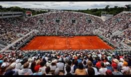A packed crowd inside Court Suzanne Lenglen watches Novak Djokovic play Alex Molcan at Roland Garros.