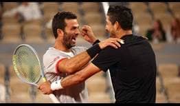 Jean-Julien Rojer and Marcelo Arevalo celebrate winning the Roland Garros title in Paris on Saturday.