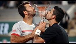 Jean-Julien Rojer and Marcelo Arevalo celebrate winning the Roland Garros title on Saturday in Paris.
