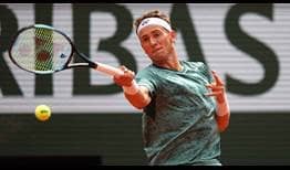 Casper Ruud hammers a forehand at the start of the second set against Rafael Nadal.