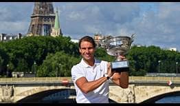 Rafael Nadal celebrates his 14th Roland Garros title on Monday with the Eiffel Tower in the background.