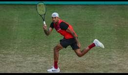 Nick Kyrgios advances past Stefanos Tsitsipas in Halle on Wednesday.