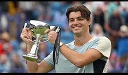 Taylor Fritz celebrates winning his second trophy of the season on Saturday in Eastbourne.