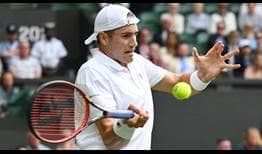 John Isner defeats Andy Murray in four sets on Wednesday to reach the third round at Wimbledon.