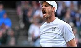 Andy Murray roars with the Wimbledon Centre Court crowd during a thrilling four-set match with John Isner.